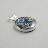 Silver pendant round with a composition of watch parts on a blue background watches art handmade original elegant exceptional unique luxury exclusive jewelry 2.JPG