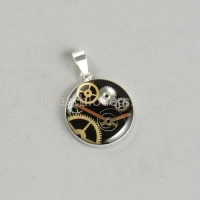 Silver round pendant with a composition of watch parts on a black background watches handmade art original elegant exceptional unique luxury exclusive jewelry 3.JPG